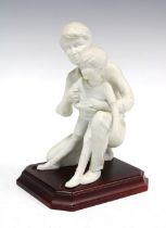 Kaiser bisque pottery father and son figure group, on a wooden plinth, printed factory marks, 12 x