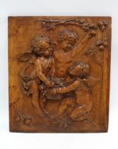 Walnut cherub carved panel, 42 x 48cm.