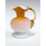 Victorian cased glass jug in amber and white, 13 x 15cm.