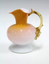 Victorian cased glass jug in amber and white, 13 x 15cm.