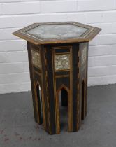 An early 20th century mother of pearl inlaid table, hexagonal top on Islamic style base, 44 x 51cm.