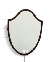 An early 20th century mahogany shield shaped mirror, 31 x 40cm.