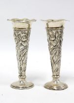 A pair of Art Nouveau silver vases by William Comyns, London 1906, 13.5cm (2)