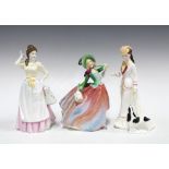 Three Royal Doulton porcelain figures to include Autumn Breezes, Sarah and Dairy Maid (3) 22cm.