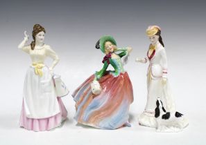 Three Royal Doulton porcelain figures to include Autumn Breezes, Sarah and Dairy Maid (3) 22cm.