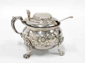 Victorian silver mustard, hinge cover and shell thumbpiece, floral repousse decoration, Hilliard &