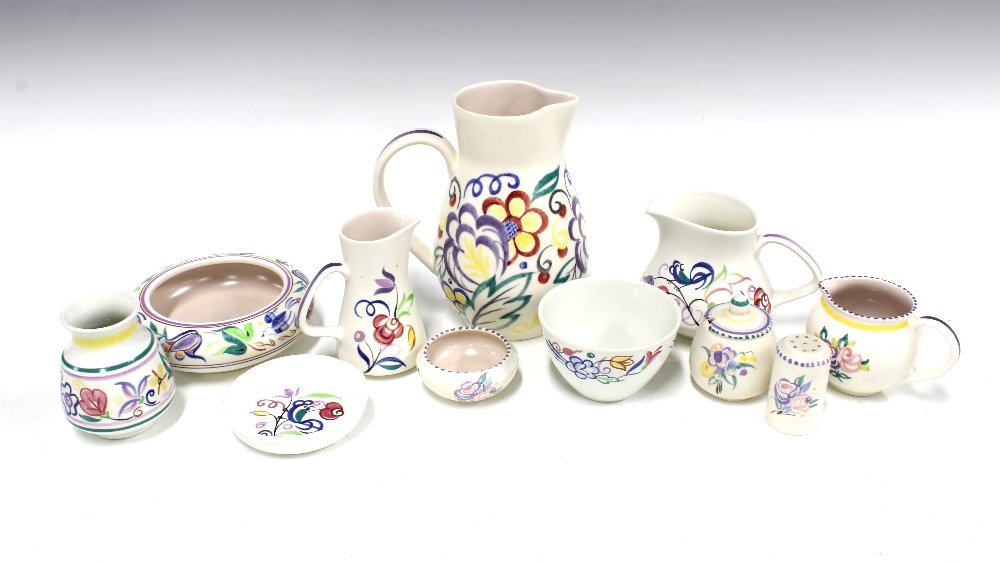 A collection of Poole Pottery, floral decorated in coloured enamels, to include jugs, cruets and