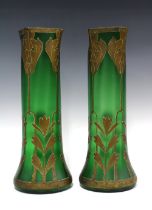 A pair of French Art Nouveau green glass vases with stylised leaf pattern in gilt, of tall