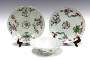 Two Chinese fruit and flower pattern plates and a similarly decorated bowl, (3) 23cm.