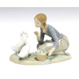 Lladro figure of a girl feeding two geese, printed backstamp, 23 x 18cm.