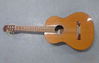 An Almansa Spanish acoustic guitar, 38 x 100cm.