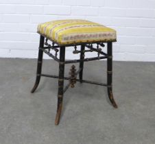 Victorian Aesthetic Movement ebonised and gold lacquered faux bamboo stool, with an upholstered top,