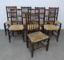 Matched set of eight oak Lancashire spindle back chairs with woven rush seats, 49 x 97 x 40cm. (8)