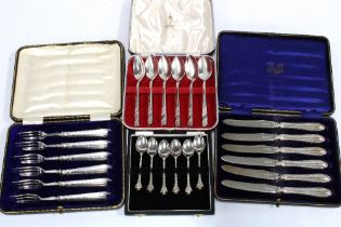 Cased flatwares to include a set of six silver handled pastry forks, set of six silver fruit