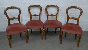 Set of four Victorian mahogany side chairs with carved toprails and splats, upholstered seats, on