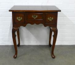 Walnut lowboy, typical design, with three drawers and acanthus capped cabriole legs, 69 x 73 x 45cm.