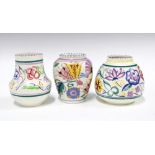 Three Poole Pottery vases, floral decorated in coloured enamels (3) 13 x 12cm.