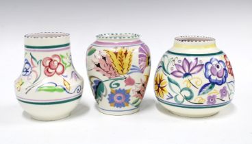 Three Poole Pottery vases, floral decorated in coloured enamels (3) 13 x 12cm.