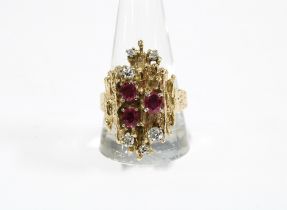 Vintage 9ct gold ruby and diamond dress ring, London 1972, with three oval rubies and six
