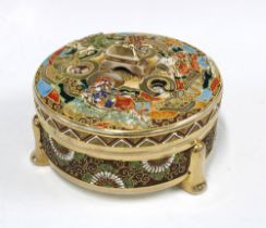 Japanese Satsuma style earthenware box and cover, of circular form and decorated with figures and