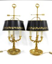 Pair of Bouillotte brass table lamps with black and gilt toleware shades, 36 x 78cm. (2)