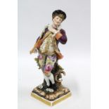 19th century Volkstedt porcelain figure of a Gallant Gent, wearing a puce jacket and floral