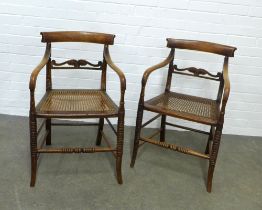 Pair of regency stained ash open armchairs, curved toprails and carved horizontal splat, caneworks