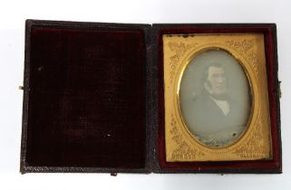 Victorian Ambrotype of a Gent, in a fitted leather case with gilt metal mount, overall size 8 x 6cm