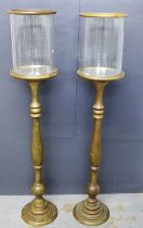 Pair of torchere stands with glass lantern style tops, detachable with mirrored base, 27 x 99cm. (2)