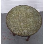 Early 20th century side table, the circular brass top with Islamic style calligraphy, 38 x 39cm.