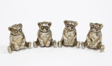 Four novelty white metal pepper pots in the form of bears 3.5cm, (4)