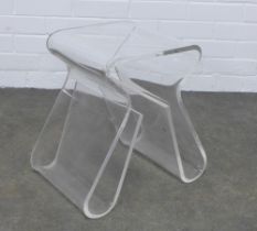 An Umbra Magino clear acrylic stool and magazine rack, designed by Karim Rashid, 43 x 42 x 30cm.