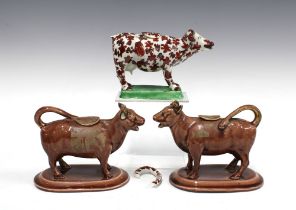 Cow creamers to include a pair of lustre glazed creamers and a Glamorgan style cow creamer , tallest
