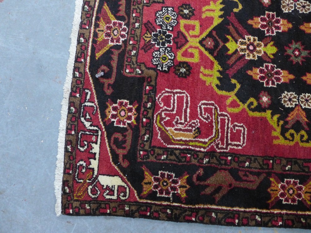 Persian rug, red field with two medallions and Rug with red field and flowerhead border, 202 x - Image 3 of 4