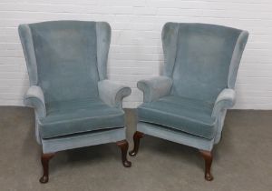 A pair of Parker Knoll wing back armchairs, pale blue upholstery and cabriole legs, 76 x 97 x