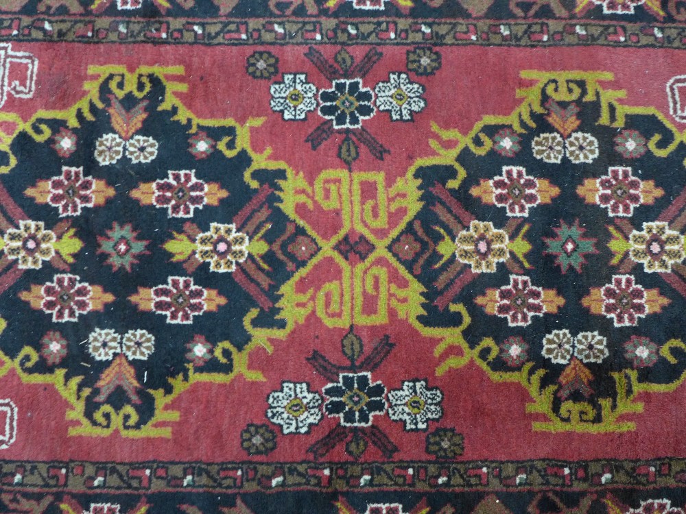 Persian rug, red field with two medallions and Rug with red field and flowerhead border, 202 x - Image 2 of 4