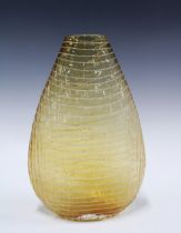 An art glass vase of tapering form, orange with white line inclusions, 31cm