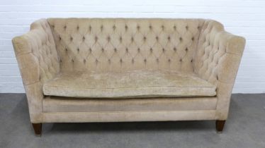 A contemporary button back upholstered two seater sofa, 188 x 93 x 62cm.