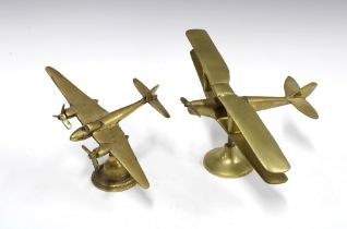 A brass model of a Mosquito plane, 16 x 26cm, together with a bi-plane (2)