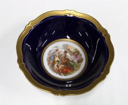 Vienna porcelain style bowl, the well with a scene of classical figures against a cobalt blue