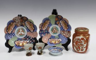 A Kutani porcelain jar and cover, 12cm, two scalloped edge plates, a small dish and two pottery sake