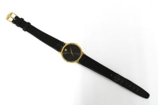 MOVADO, a Gents manual wind wristwatch, black museum dial and gilt marker at 12, black leather strap