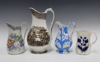 A collection of four 19th century Staffordshire and Scottish pottery jugs, tallest 32cm (4)