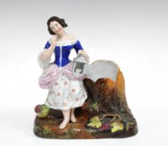 19th century porcelain figure with spill vase, on a naturalistic base, 17cm