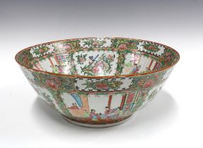 Large Chinese famille rose punch bowl, typically decorated with figures and panels of flowers and