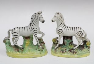 A pair of Staffordshire pottery Zebra, (one a/f) (2) 12cm