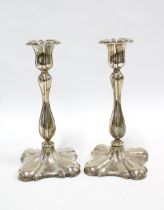 A pair of late Victorian silver candlesticks by William Hutton & Co Ltd, London 1898, weighted bases