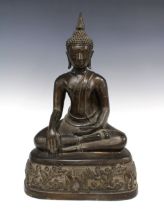 Bronze Buddha, modelled seated on a floral engraved pedestal, 43cm