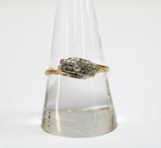 Early 20th century three stone diamond ring, set in yellow metal, worn hallmarks to inner band