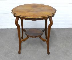 An Edwardian mahogany occasional table with a circular top with pie crust edge, undertier and